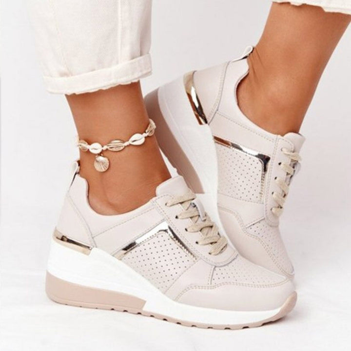 Baskets compensées Géraldine pour femme, effet compensé élégant et conception confortable pour un look sophistiqué au quotidien.