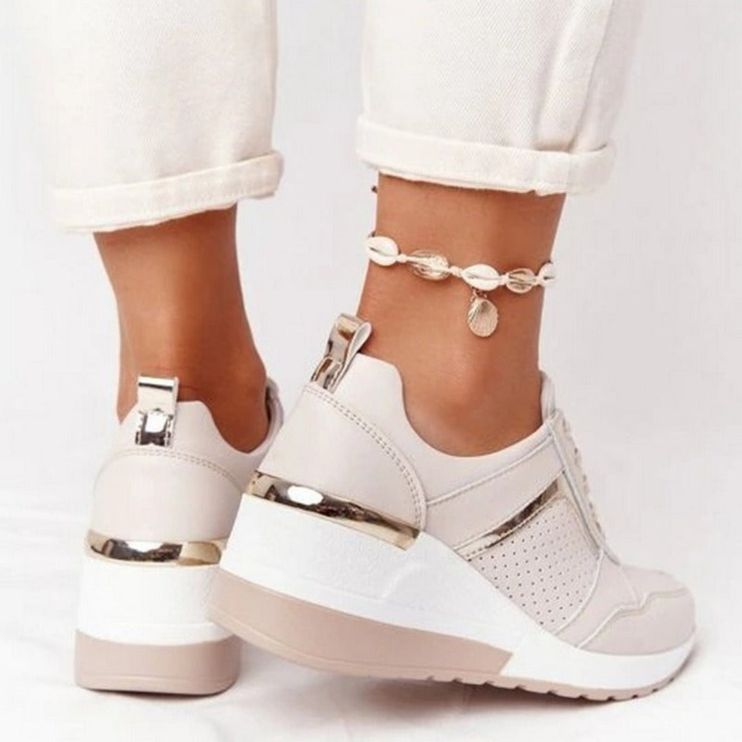 Baskets compensées Géraldine pour femme, effet compensé élégant et conception confortable pour un look sophistiqué au quotidien.