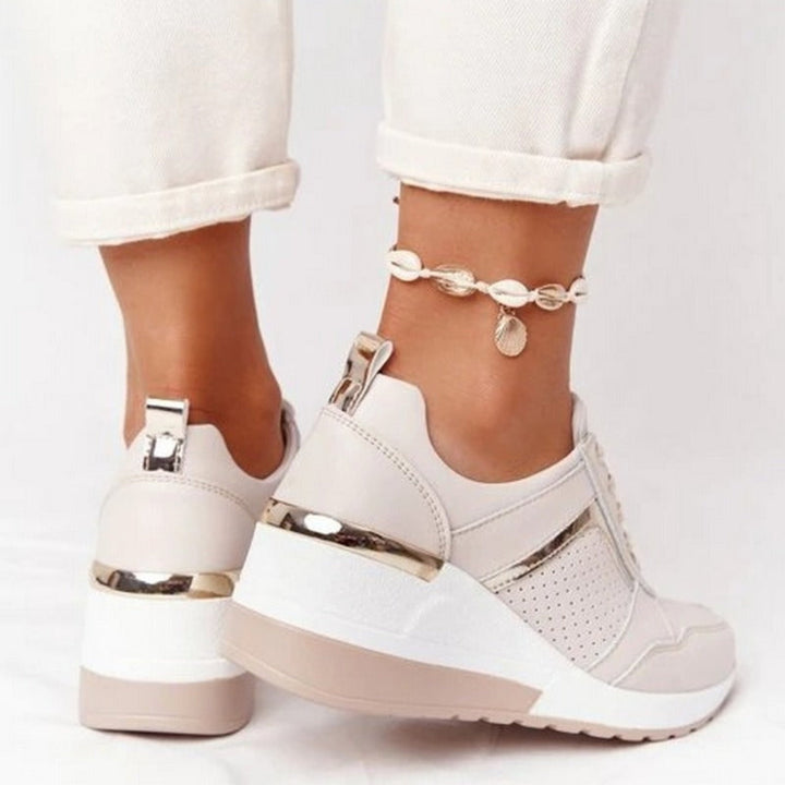 Baskets compensées Géraldine pour femme, effet compensé élégant et conception confortable pour un look sophistiqué au quotidien.