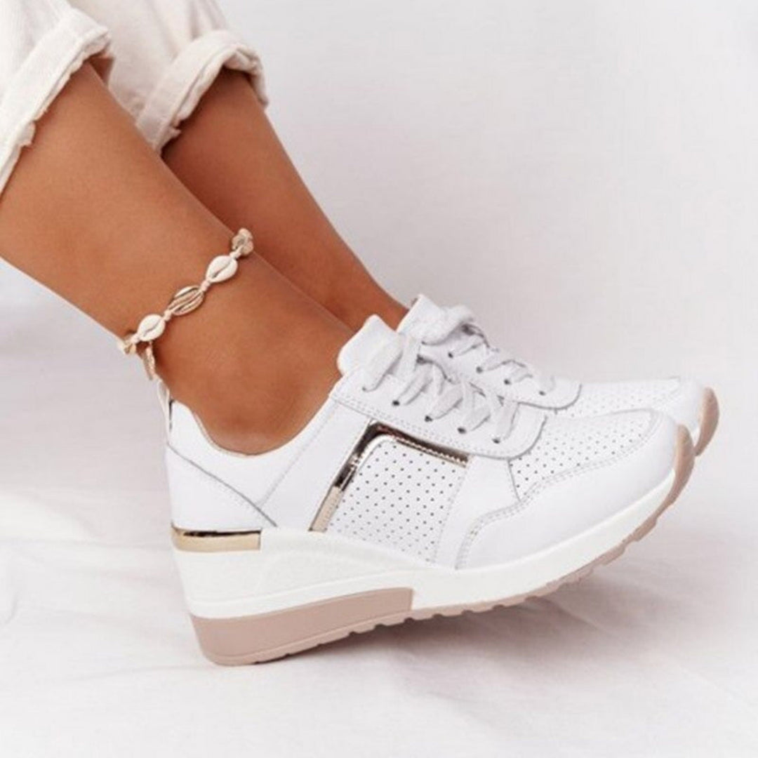 Baskets compensées Géraldine pour femme, effet compensé élégant et conception confortable pour un look sophistiqué au quotidien.