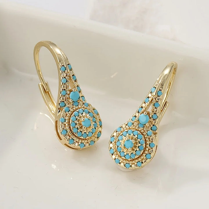 Boucles d’Oreilles Pendantes Dorées avec Turquoise